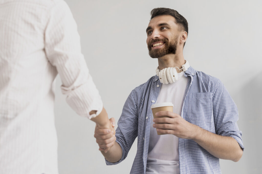 low-angle-handshake-office-view