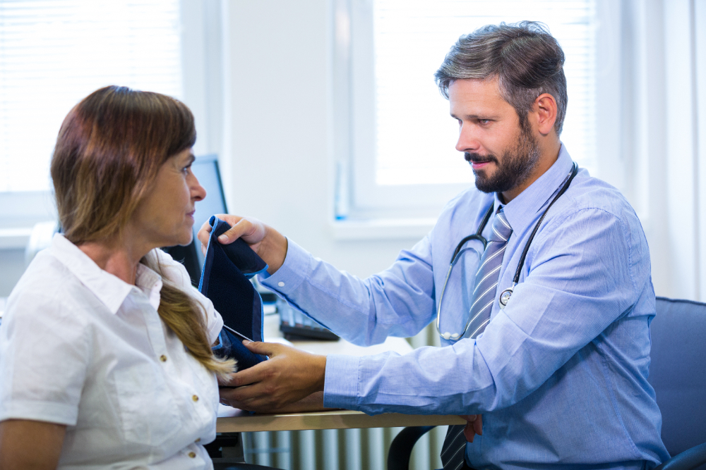 patient having their blood pressure taken at a doctors visit